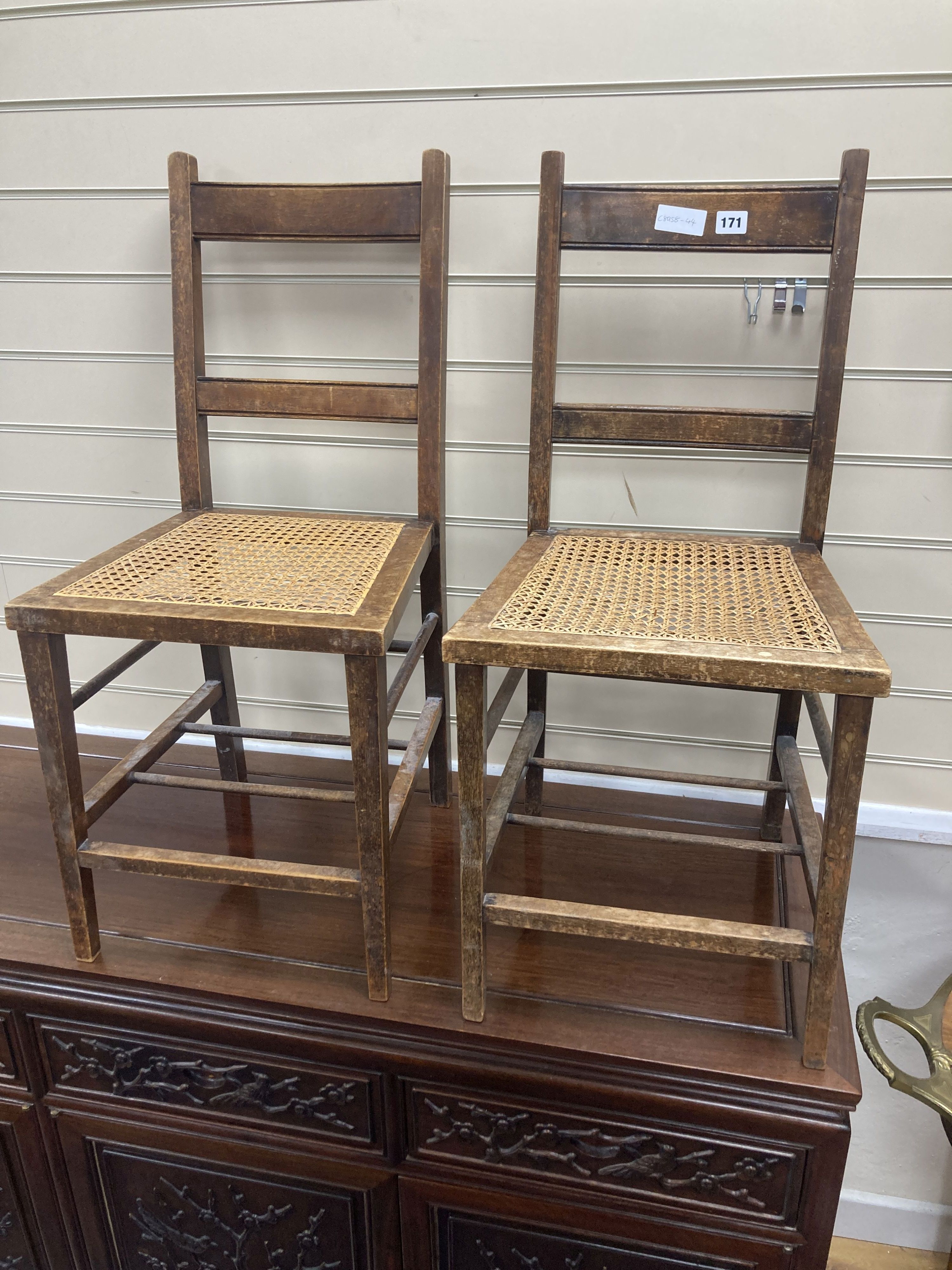 A pair of George V Coronation chairs stamped with Royal Cypher